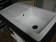 Square ceramic sink with a large drain